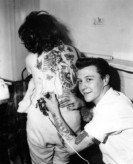 1950s Photo of Rockabilly Bad Boy Giving His Girlfriend A Back Story - Rebel Style - Fashion Inspiration